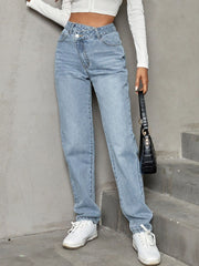 Light wash denim jeans with asymmetric waistband and straight leg cut.