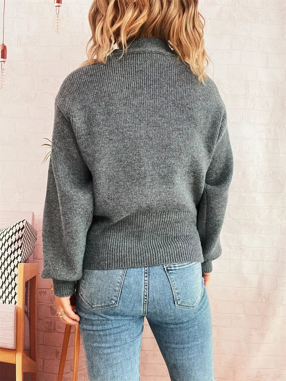 Gray ribbed V-neck button-through cardigan with balloon sleeves.