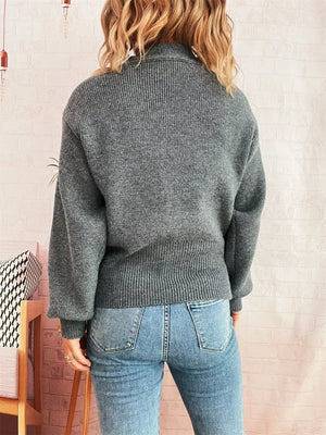 Gray ribbed V-neck button-through cardigan with balloon sleeves.