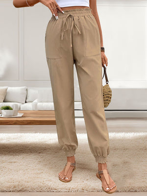 Tan linen-blend joggers with drawstring waist and gathered cuffs