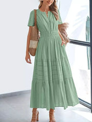 Moss green V-neck tiered midi dress with smocked waist and short sleeves.