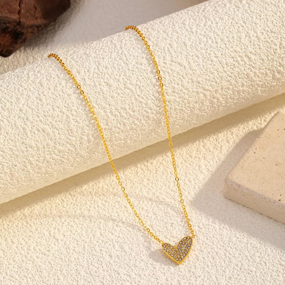 Gold necklace with a sparkling rhinestone heart pendant