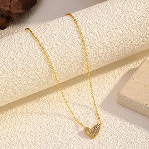 Gold necklace with a sparkling rhinestone heart pendant