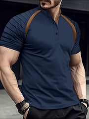 Navy polo shirt with mandarin collar, contrast tan raglan sleeves and striped detail.