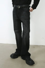 Faded black denim flare jeans with a casual, chic style.