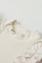 Beige ribbed mock neck top with ruffled sleeves and neckline detail