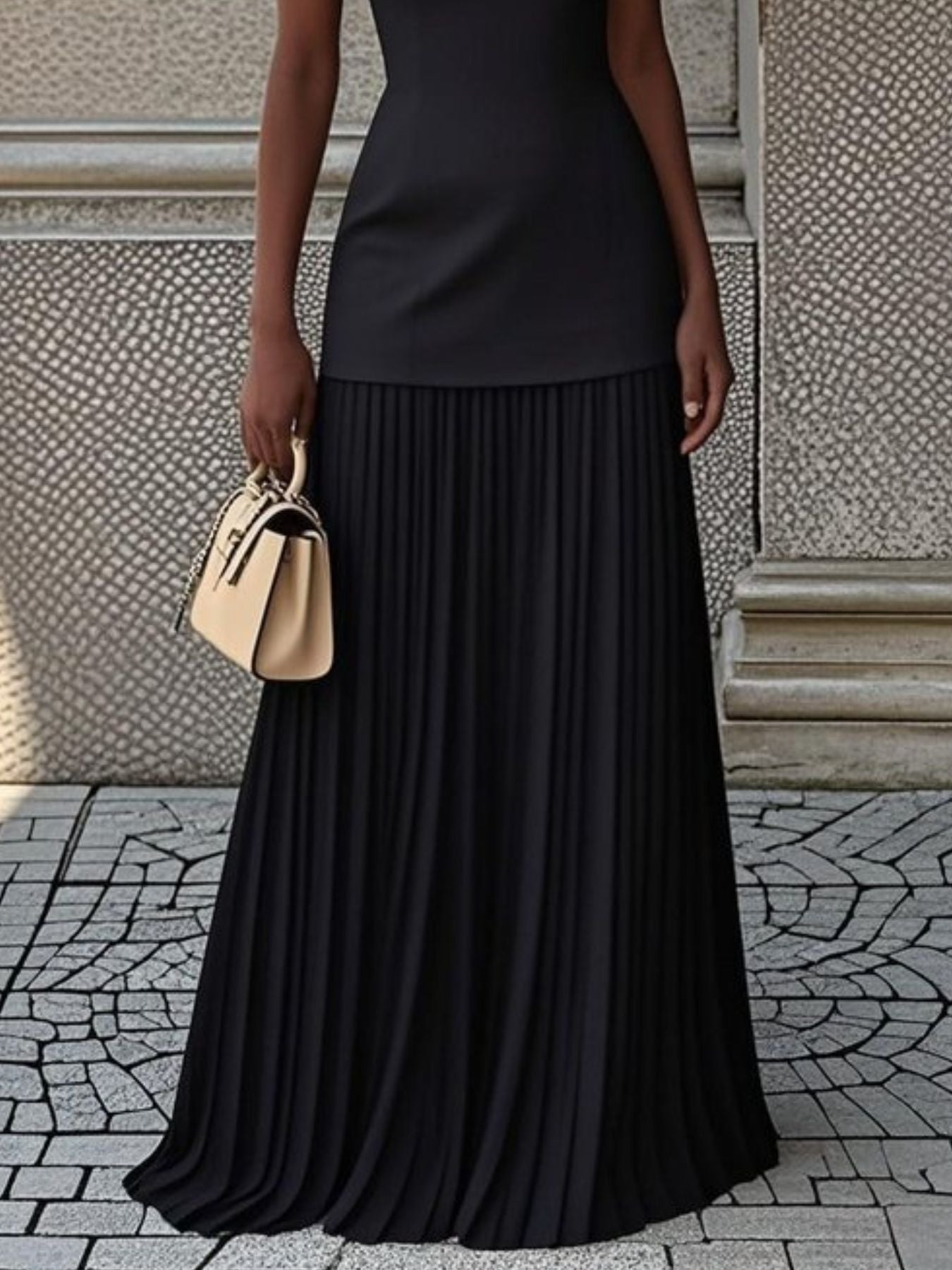 Black sleeveless boat neck top with a pleated maxi skirt set
