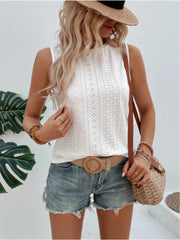 White eyelet sleeveless top with mock neck and diamond pattern detail