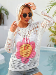 White crochet lace-up hoodie with a pink and yellow smiley face flower graphic.