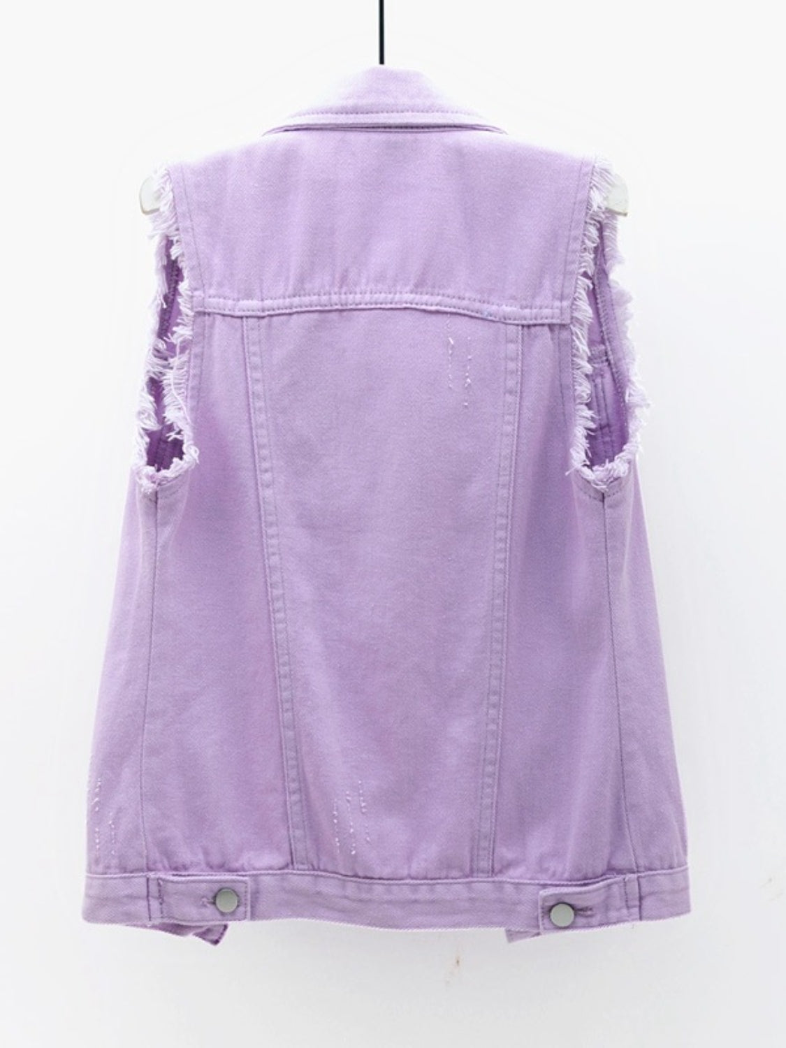 Lavender denim vest with frayed shoulders and distressed details.