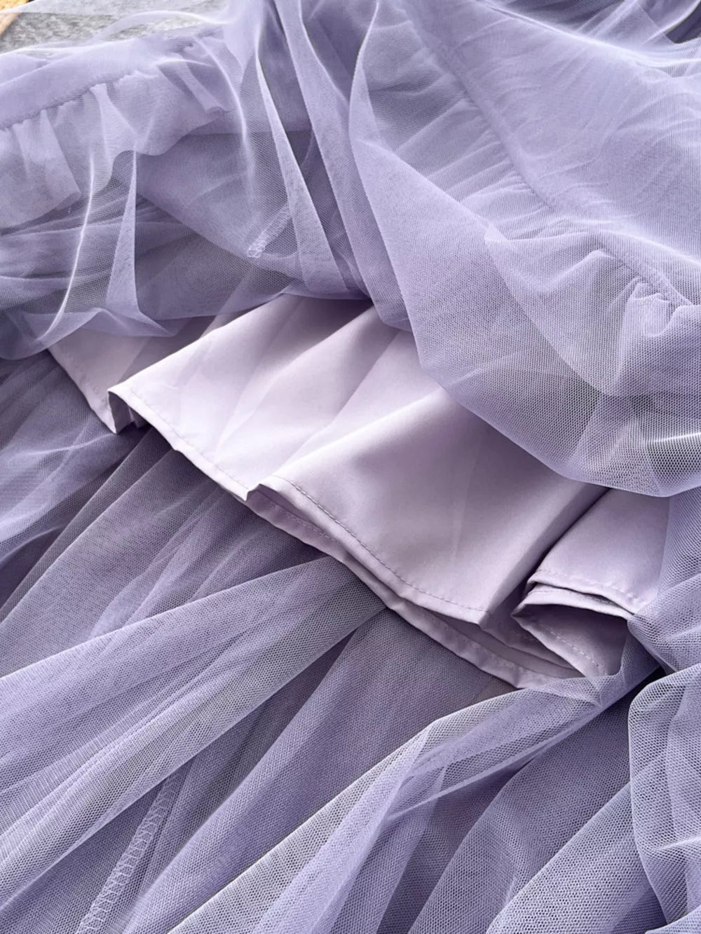 Purple tiered tulle skirt with lining, showing texture and layers