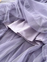 Purple tiered tulle skirt with lining, showing texture and layers