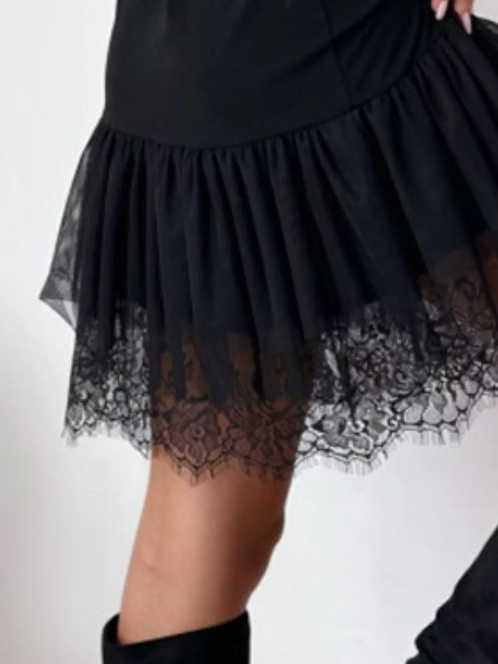 Black mini dress with lace-trimmed tulle hem