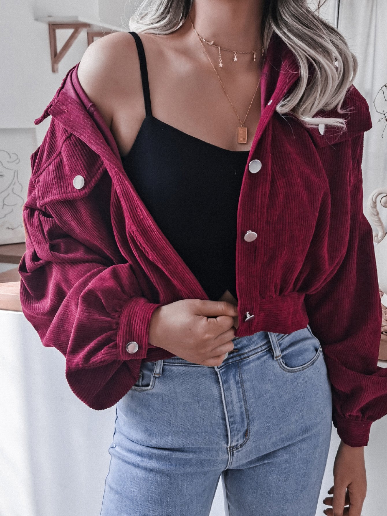 Wine corduroy cropped jacket with balloon sleeves and button front.