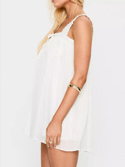 White frilled square neck mini dress with drawstring tie and ruffled straps.