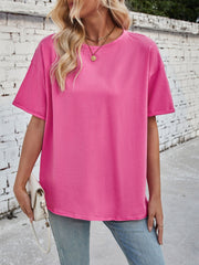 Oversized hot pink cotton tee with seam details and rolled sleeves.