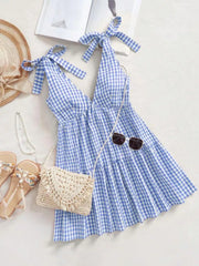 Blue gingham maternity mini dress with tie shoulders and ruffle hem