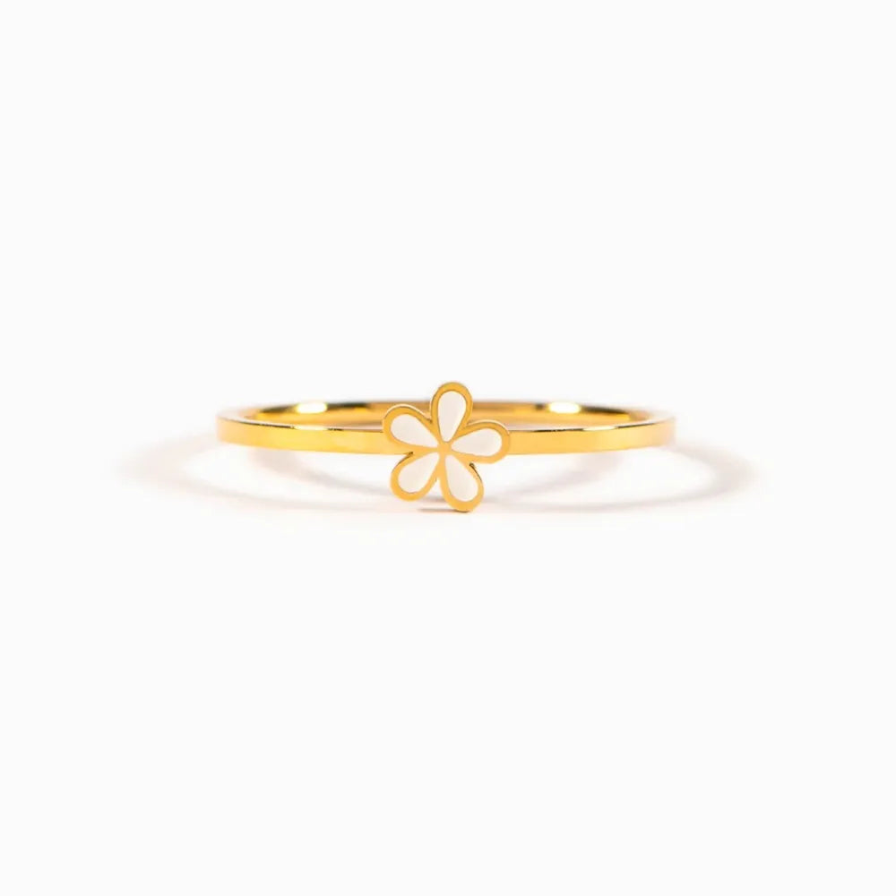 Delicate floral enamel ring with white flower detail on gold band