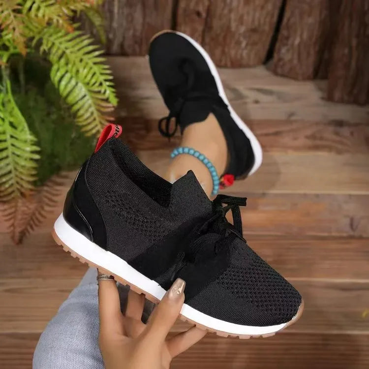 Black knit and suede lace-up sneakers with white soles and gum outsoles.