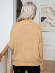 Khaki acrylic cable knit turtleneck sweater with textured details.