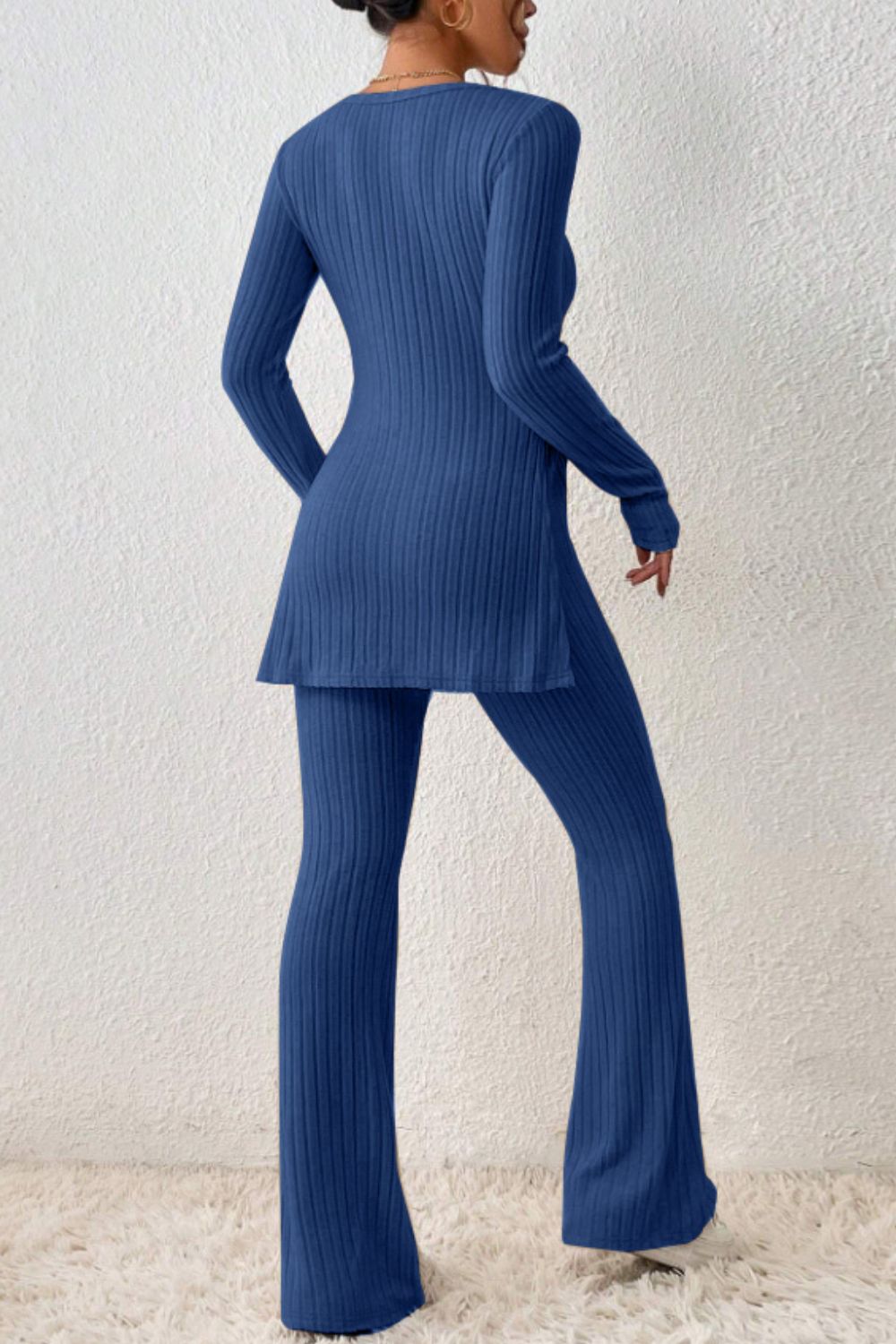 Royal blue ribbed knit co-ord set with long sleeves, side slit tunic and flared pants.
