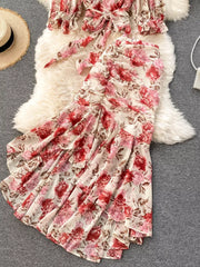 Floral two-piece crop set with ruched skirt and bow detail, pink and red flowers on cream.