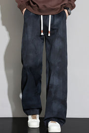 Black relaxed fit sweatpants with cloud pattern and white drawstring.