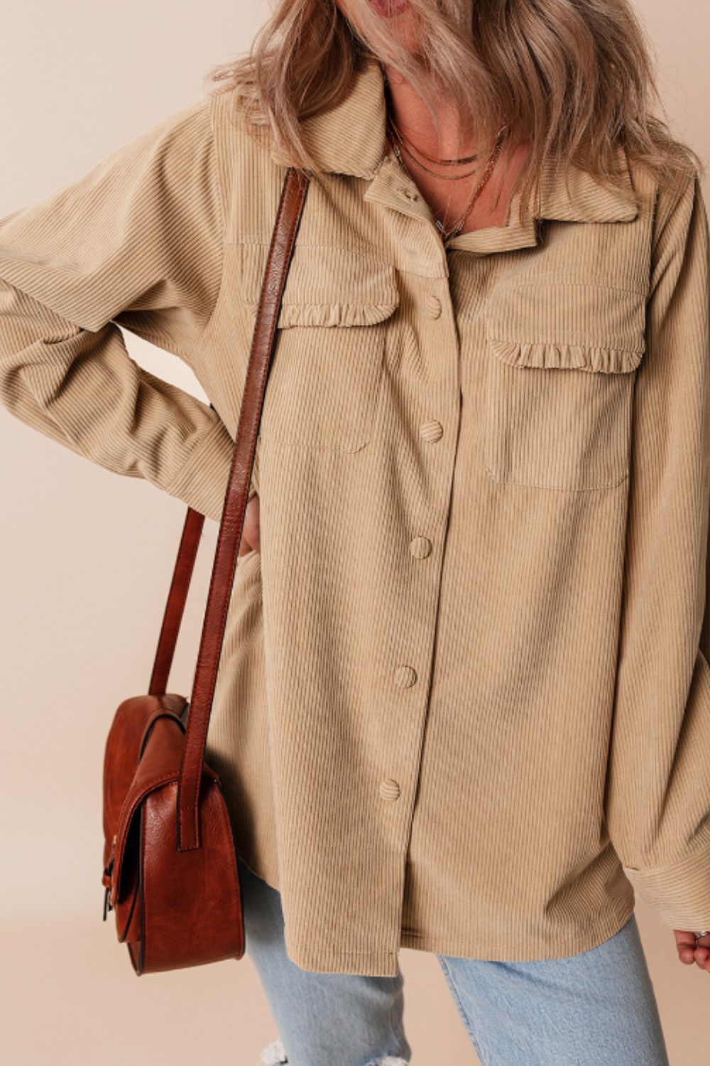 Tan corduroy utility shirt with ruffled chest pockets and button front.