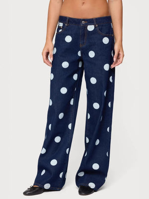 Polka dot wide leg denim maternity jeans in dark blue with white polka dots.
