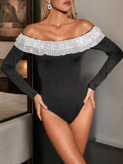 Black off-the-shoulder bodysuit with sequin trim and long sleeves