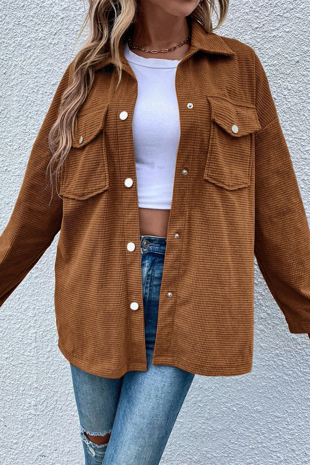 Brown waffle knit overshirt with button-down front and two patch pockets.