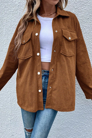 Brown waffle knit overshirt with button-down front and two patch pockets.