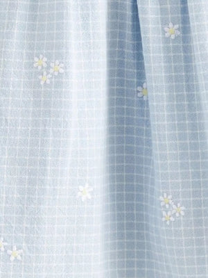 Baby dress in light blue gingham with embroidered white daisies and cap sleeves.