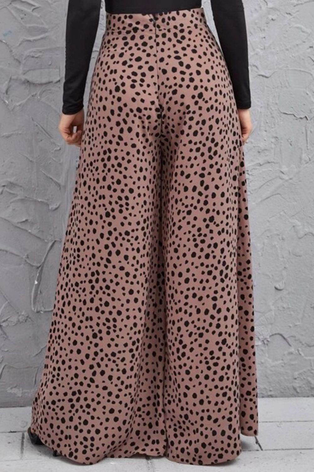 Spotted wide-leg palazzo trousers in dusty pink with a black animal print.