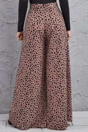 Spotted wide-leg palazzo trousers in dusty pink with a black animal print.
