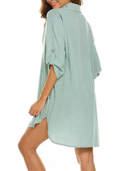 Light green polyester oversized collared shirt with roll-tab sleeves and side slits.