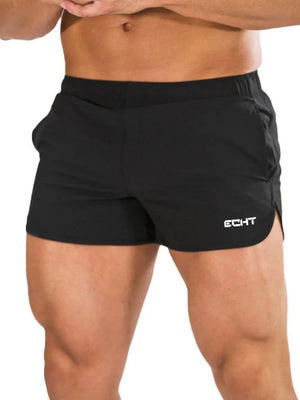Black athletic shorts with quick-dry fabric and a white logo detail.