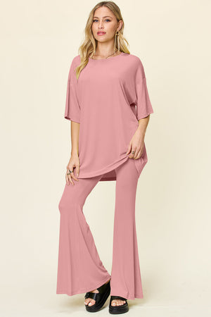Dusty Pink oversized tee and flare leg pants set with crew neck and short sleeves.