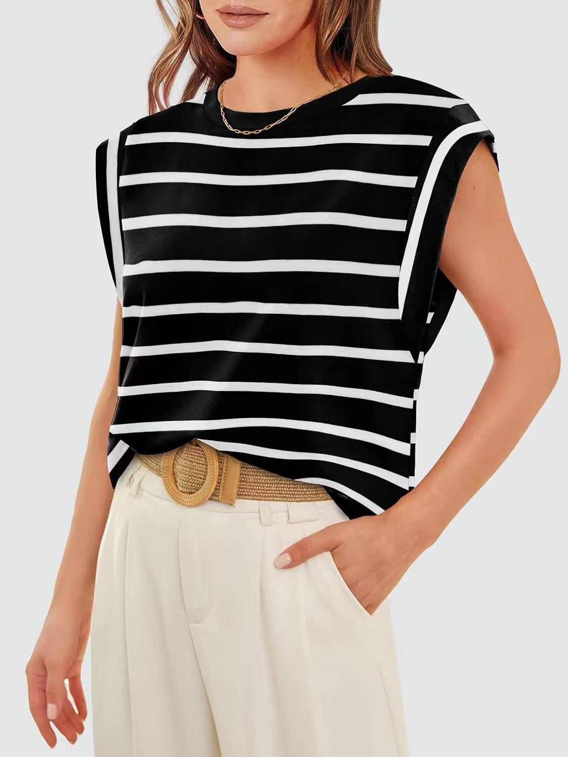 Black and white striped tank top with padded shoulders and a crew neck.