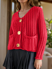Chunky knit red cardigan with statement buttons and pockets.