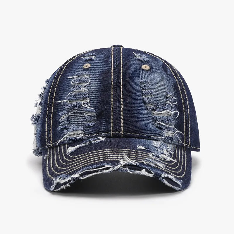 Dark ripped denim baseball cap with distressed details and contrast stitching.