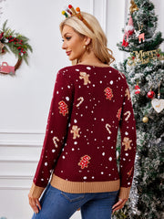 Burgundy knit sweater with gingerbread man and candy cane graphic pattern.