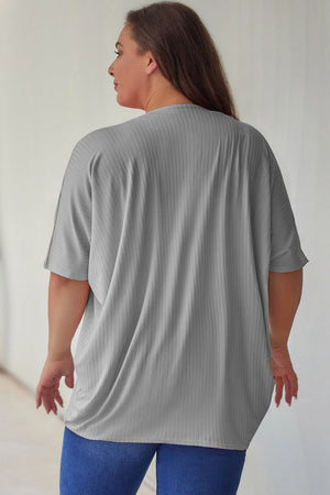 Light gray ribbed batwing cardigan with short sleeves and a drape front.