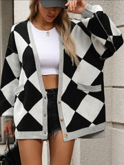 Black and white argyle knit oversized cardigan with pockets and grey trim.