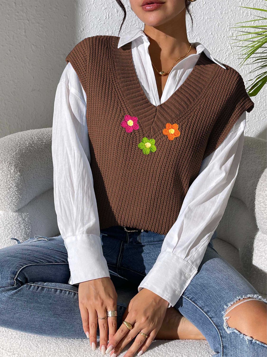Coffee brown ribbed knit vest with embroidered flowers and V-neck.