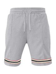 Gray textured knit drawstring shorts with striped hem detail and pockets.