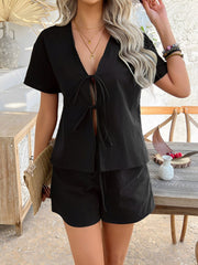 Black linen tie-front top and shorts set with short sleeves and v-neck.