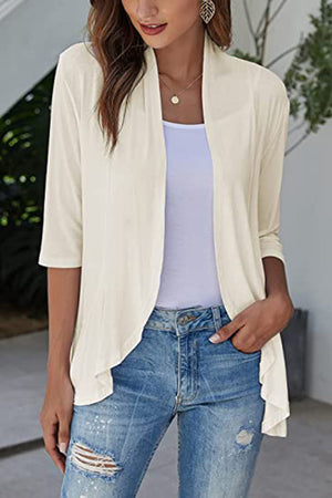 Ivory waterfall cardigan with 3/4 sleeves and asymmetric hemline, styled with a white tank and jeans.