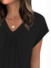 Black ruched v-neck t-shirt with short sleeves and layered gold necklaces.