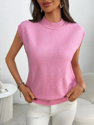 Pink ribbed knit sleeveless mock neck top with ribbed trim.